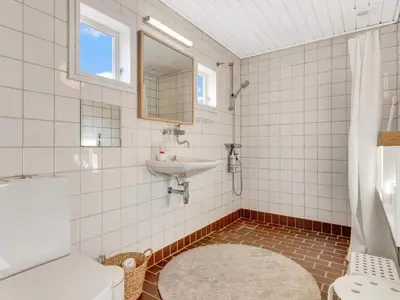 a bathroom with a sink and a toilet at Charming Retreat in Rodhus - By Traum Ferienwohnungen in Pandrup