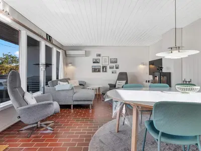 a living room with a table and chairs at Charming Retreat in Rodhus - By Traum Ferienwohnungen in Pandrup