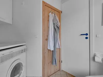 a door in a kitchen with a washing machine at Green Oasis near Blokhus - By Traum Ferienwohnungen in Blokhus