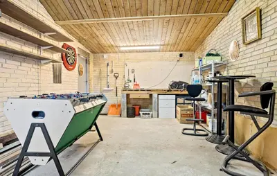 a garage with a boat on display in a room at 2 Bedroom Nice Home In Roslev in Roslev