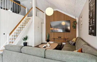 a living room with a couch and a tv at Stunning Home In Spøttrup With Sauna in Spottrup