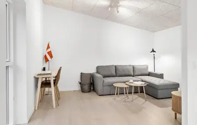 a living room with a couch and a table at 2 Bedroom Pet Friendly Home In Vemb in Vemb
