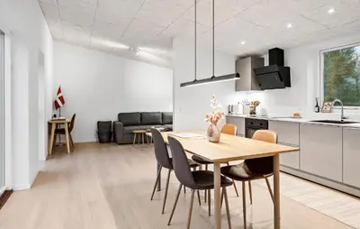 a kitchen and dining room with a table and chairs at 2 Bedroom Pet Friendly Home In Vemb in Vemb