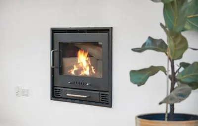 a fireplace in a wall with a fire in it at Gorgeous Home In Nibe With Wifi in Nibe