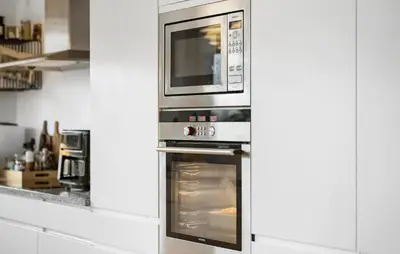 a kitchen with an oven with a microwave above it at Gorgeous Home In Nibe With Wifi in Nibe