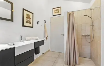 a bathroom with a sink and a shower at Gorgeous Home In Nibe With Wifi in Nibe