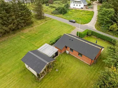 an aerial view of a house with a solar roof at Lovely Holiday Home, Renovated In 2024, Located In Hanstholm By The North Sea in Hanstholm