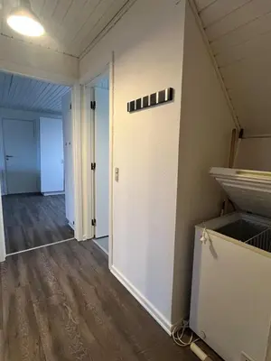 an empty room with a door and a hallway at Perfect space for you and your colleague in Vinderup