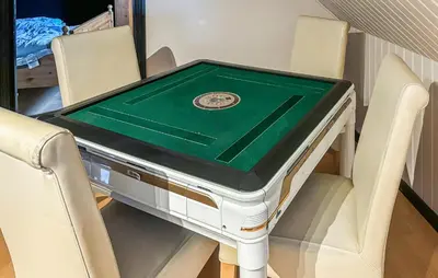 a ping pong table with chairs in a room at Awesome Home In Øster Assels With Wifi in Øster Assels