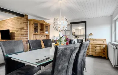 a dining room with a glass table and chairs at Awesome Home In Øster Assels With Wifi in Øster Assels