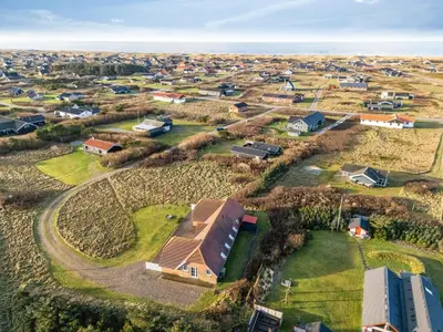 an aerial view of a residential neighborhood with houses at Family-Friendly Holiday Home With Pool, Located Close To The North Sea In Vrist in Harboør