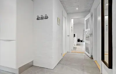 a hallway with white walls and a sign on a wall at Beautiful Home In Spøttrup With Wifi in Spottrup