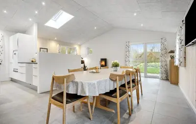 a kitchen and dining room with a table and chairs at Beautiful Home In Spøttrup With Wifi in Spottrup