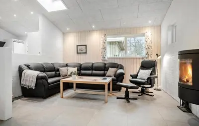 a living room with a couch and a table at Beautiful Home In Spøttrup With Wifi in Spottrup