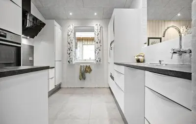 a kitchen with white cabinets and a sink and a window at Beautiful Home In Spøttrup With Wifi in Spottrup