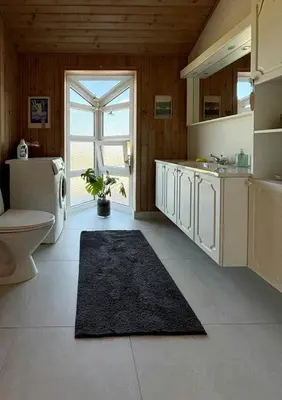 a bathroom with a toilet and a sink and a toilet at Vesterhavsluft Og Natur Ved Nationalpark Thy in Thisted