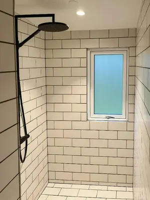 a bathroom with a shower with a window at Nature-Rich Oasis With Views Over The Limfjord in Roslev