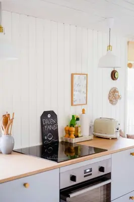a kitchen with white walls and a counter with a toaster at Experience 