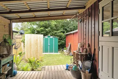 an outside view of a backyard with a wooden patio at Lifestyle Near Sea And Town in Nykøbing Mors