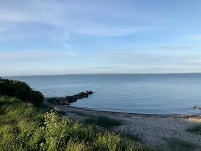 a view of a body of water with rocks in it at Lifestyle Near Sea And Town in Nykøbing Mors