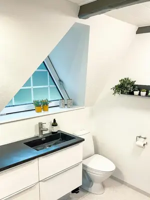 a bathroom with a sink and a toilet at Summerhouse By The North Sea in Vestervig