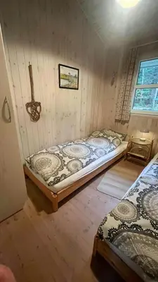a bedroom with two beds in a room at Holiday Home In Tranum Forest in Brovst