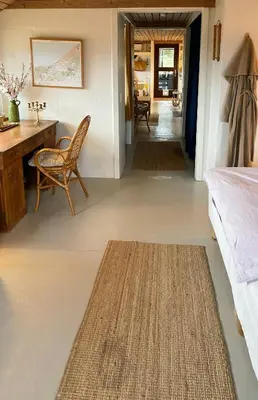 a bedroom with a desk and a bed and a table at Cosy Holiday Home 260 Metres From Tranum Beach in Brovst