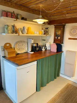 a kitchen with a counter top in a room at Cosy Holiday Home 260 Metres From Tranum Beach in Brovst