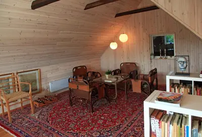 a room with a table and chairs in a room at Alt det bedste mellem hav og fjord - en hel bolig in Brovst