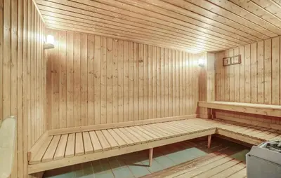 a wooden sauna with a bench in the middle at Gorgeous Apartment In Vestervig in Vestervig