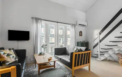 a living room with a couch and a table at Gorgeous Apartment In Vestervig in Vestervig