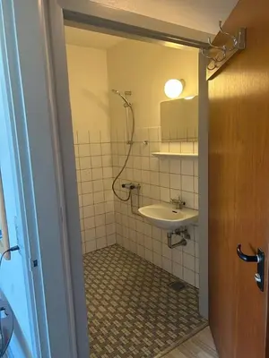 a bathroom with a sink and a mirror at Hostel Mors in Erslev