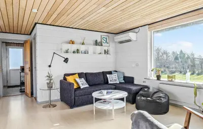 a living room with a couch and a table at Gorgeous Home In Vinderup With Wifi in Vinderup