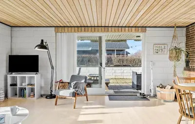 a living room with a wooden ceiling at Gorgeous Home In Vinderup With Wifi in Vinderup