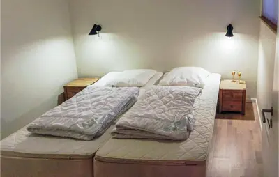 two twin beds in a room with two lights at Three-Bedroom Holiday Home Hurup Thy With A Fireplace 06 in Sindrup
