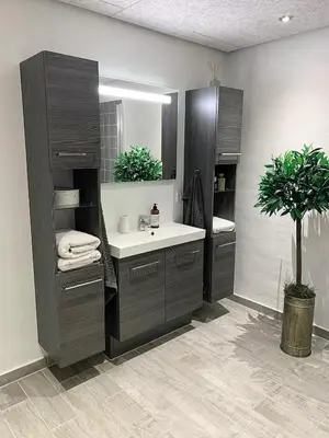 a bathroom with a sink and a mirror at Blokhus Beach House in Blokhus