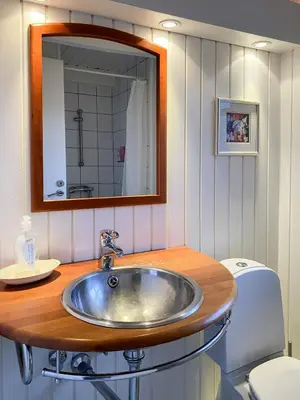 a bathroom with a sink and a toilet at Relaxed Summer House By The North Sea in Blokhus