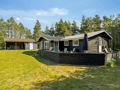a house with a large yard in front of it at Holiday Home Hansa - 3km from the sea by Interhome in Blokhus