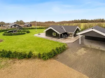 an aerial view of a house with a yard at Holiday Home Antero - 500m to the fjord by Interhome in Spottrup