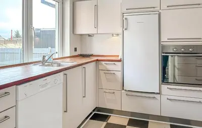 a white kitchen with a sink and a refrigerator at Gorgeous Home In Thisted With Wifi in Thisted
