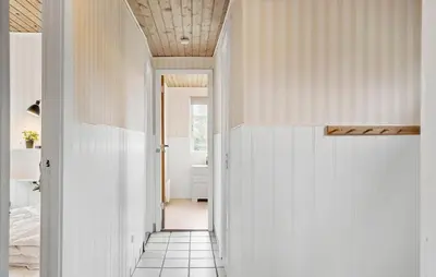 a hallway with white walls and a tile floor at Nice Home In Vinderup With Wifi in Vinderup