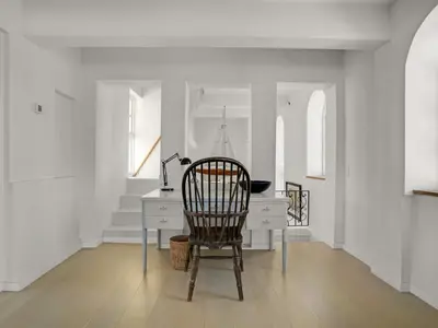 a chair sitting at a desk in a room at Holiday Home Amina - 200m from the sea by Interhome in Blokhus