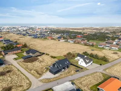 an aerial view of a small town with houses at Pool House With Activity Room, Built In 2020, With A View Of The North Sea in Nørre Vorupør