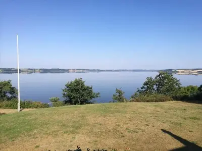 a view of a large body of water at Architect-Designed House With Private Beach in Løgstrup
