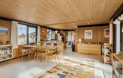 a kitchen and dining room with a table and chairs at 5 Bedroom Lovely Home In Saltum in Saltum