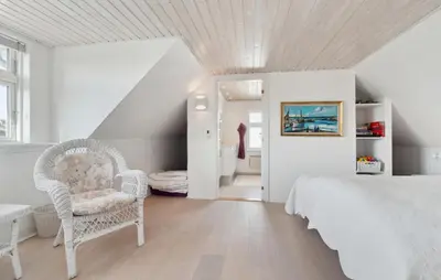 a white bedroom with a bed and a chair at Nice Home In Thisted With Wifi in Thisted
