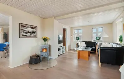 a living room with a couch and a fireplace at Nice Home In Thisted With Wifi in Thisted