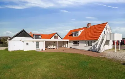 an orange roofed house with a large yard at Nice Home In Thisted With Wifi in Thisted