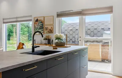 a kitchen with a sink and a large window at Lovely Home In Spøttrup With Sauna in Spottrup