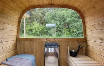 an inside view of a wooden cabin with a window at Lovely Home In Spøttrup With Sauna in Spottrup